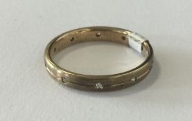 A small diamond half eternity ring in 9 carat. App