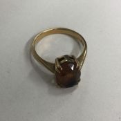 A 9 carat topaz ring in claw mount. Approx. 4 gram