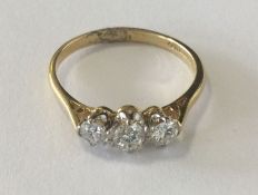 A good diamond 3 stone ring in 18 carat and platin