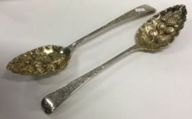 A heavy pair of George III silver berry / fruit se