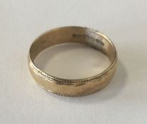 A nine carat plain wedding band. Approx. 2 grams.