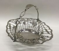 A good Georgian silver sweet basket decorated with