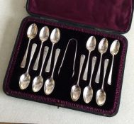 A cased set of twelve bright cut silver teaspoons.