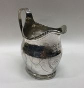 A good Georgian bright cut silver cream jug. Londo