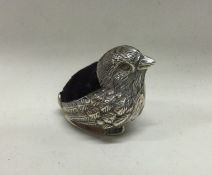 A silver pin cushion in the form of a chick. Marke