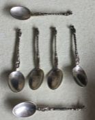 A set of six Continental silver teaspoons decorate