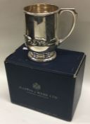 A rare cased silver christening mug decorated with