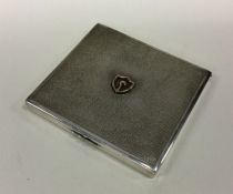 A Chinese silver cigarette case of hammered design