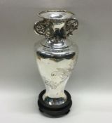 A finely engraved Chinese silver vase pierced with