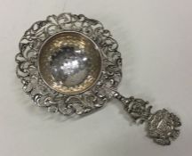 OF ROYAL INTEREST: A silver sifter / tea strainer