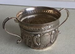 A good silver two handled porringer of Georgian de