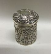 A decorative Victorian chased silver box with lift