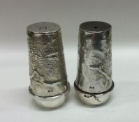 A rare pair of silver salt and pepper condiments o