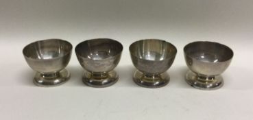 A set of four silver cups. Marked to bases. Approx