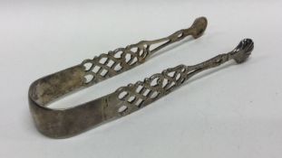 A Georgian pair of silver sugar tongs, probably Co