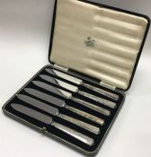 A cased set of six silver handled knives. Est. £20