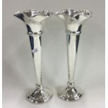 A tall pair of tapering silver spill vases. Sheffi