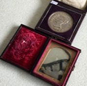 A good Victorian silver cased medal together with