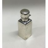 A Victorian silver scent bottle with hinged lid. B
