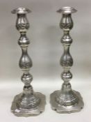 A fine pair of silver candlesticks. London 1906. B