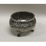 A chased silver bowl on feet. Circa 1920. Approx.