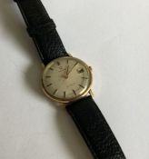 An Omega gents gold wrist watch. Est. £60 - £80.