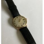 An Omega gents gold wrist watch. Est. £60 - £80.