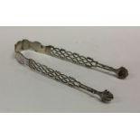 A heavy pair of Georgian silver pierced ice tongs.