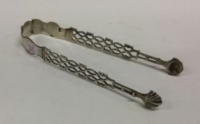 A heavy pair of Georgian silver pierced ice tongs.