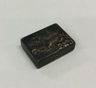 A Japanese silver hinged box engraved with a templ