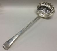 A fine and heavy George III silver soup ladle. Lon