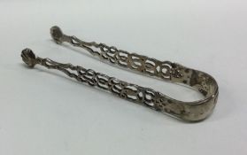 A pair of George III silver pierced ice tongs with