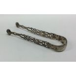 A pair of George III silver pierced ice tongs with