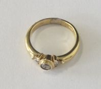 A fine quality diamond single stone ring with gold