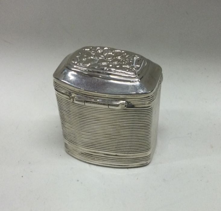 A Continental hinged silver box with chased flower - Image 2 of 2