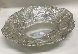 A decorative Victorian silver chased serving dish.