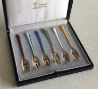 A set of six Danish silver and enamelled forks. Ap