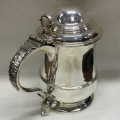 A heavy Georgian style silver lidded tankard with