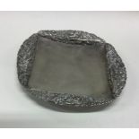 A rare Japanese silver salver chased with dragons