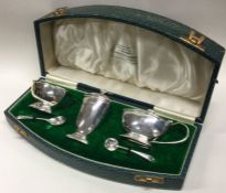 A good cased silver three piece Art Deco cruet. Lo