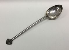 A Chinese silver serving spoon engraved with a bir