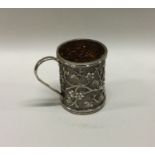 A small heavy Chinese silver mug decorated with ba