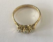 A good antique diamond three stone ring in claw mo