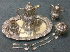 A large Indonesian silver twelve piece coffee serv