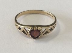 A small nine carat heart shaped ring. Approx. 2 gr