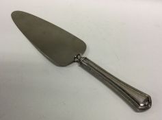 A silver handled cake slice. Marked Sterling. Appr