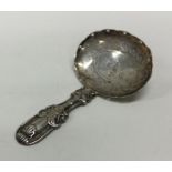 A George III silver caddy spoon with shell pattern