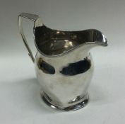 A heavy 18th Century George III silver cream jug.