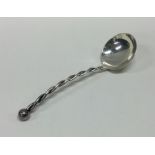 A stylish silver ladle with spiral decoration. Mar