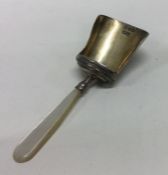 A George III bright cut silver caddy spoon. Birmin